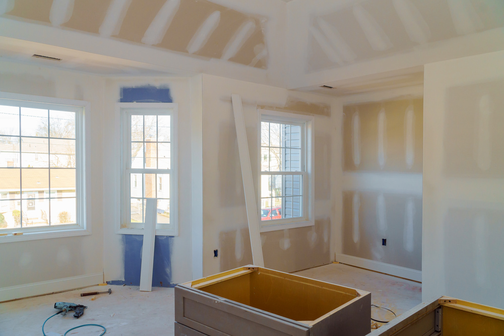 Partially Completed Interior Remodel Room under Construction with Gypsum Plaster Boards